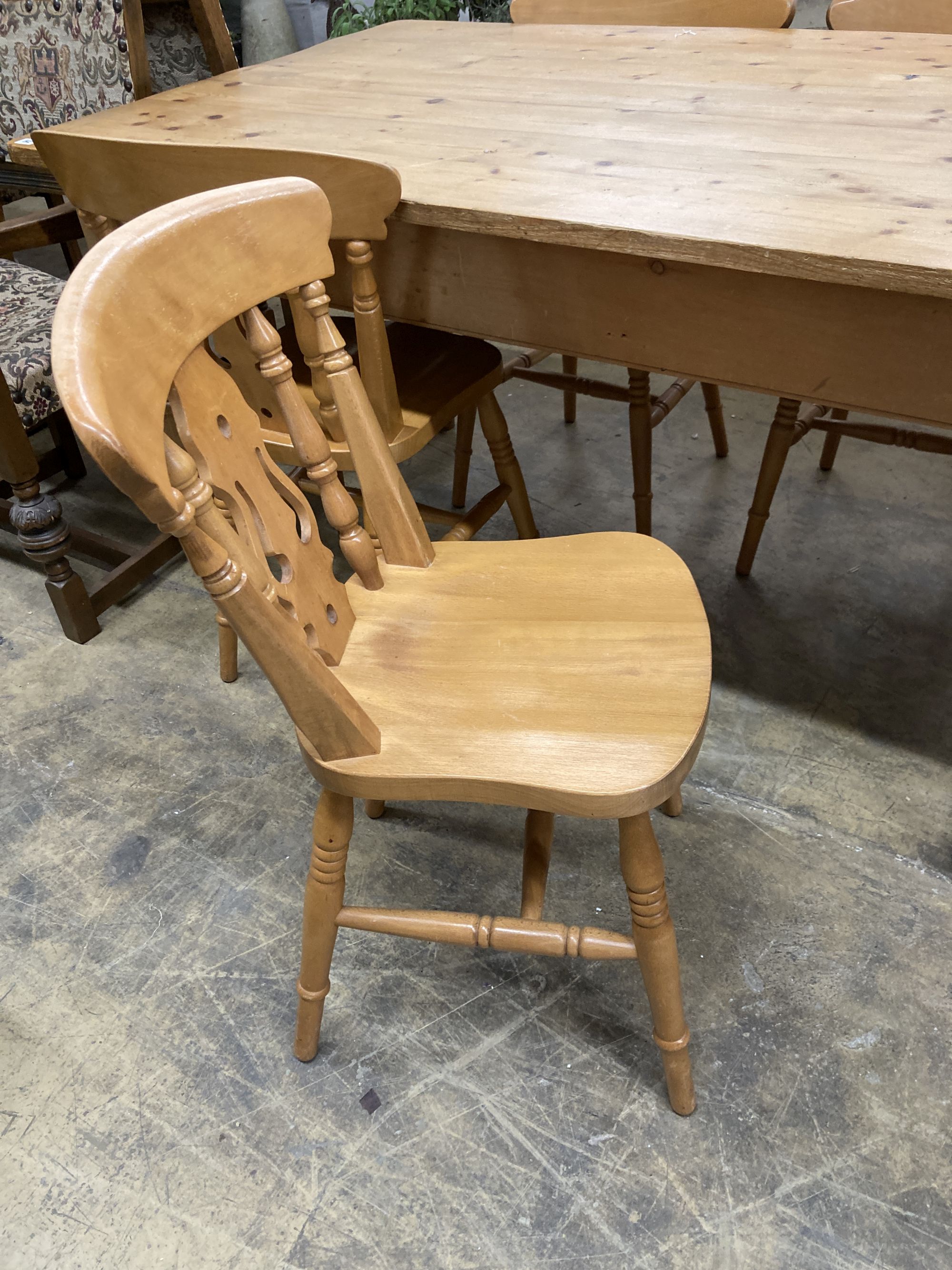 A Victorian style rectangular pine kitchen table, length 152cm, depth 90cm, height 78cm, together with four Windsor beech kitchen chairs